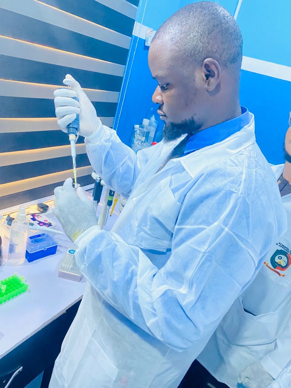 Toheeb Ayodeji Sodiq at the bench using a micropipette